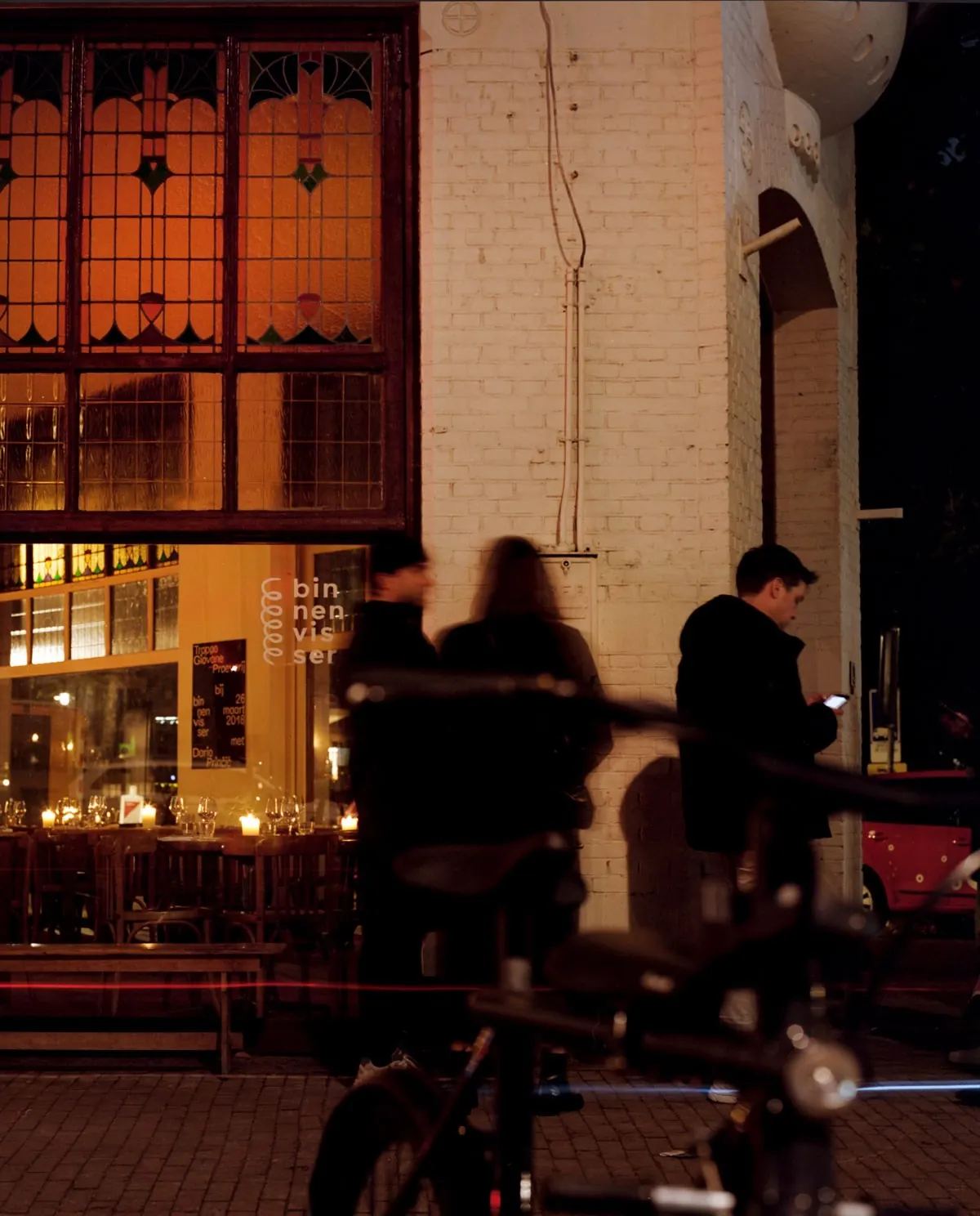 the lit-up front of binnenvisser in the evening